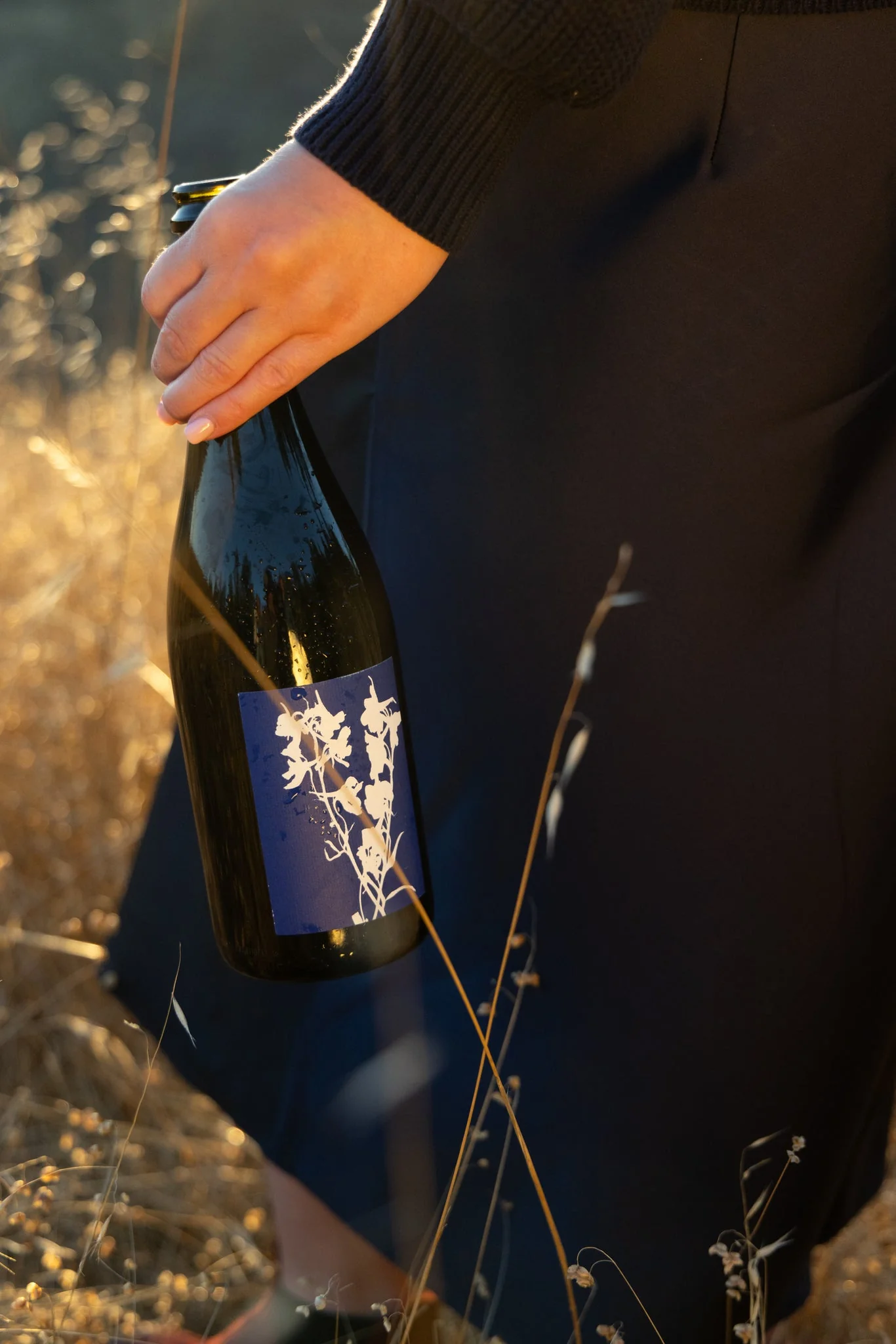 2023 Delphinium California Crémant sparkling wine bottle with blue delphinium flower label